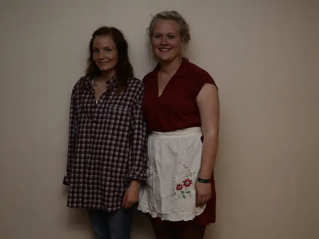 In this image we can see women standing on the floor.